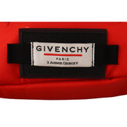 Close-up of Givenchy Paris logo patch on a red designer bag