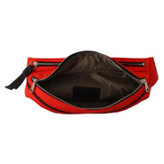 Open red designer belt bag with silver zipper, showing spacious interior