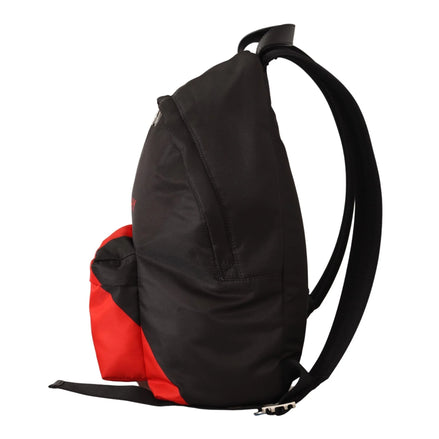 Black and red designer backpack side view with adjustable straps on white background