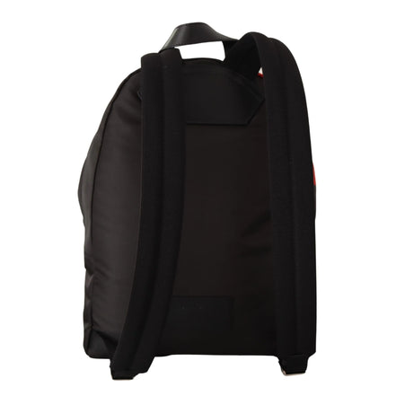 Back view of black designer backpack with padded shoulder straps on white background