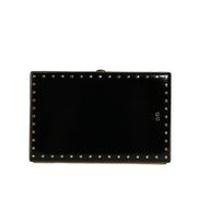 Poșetă de seară tip clutch Dolce & Gabbana din piele neagră cu ținte și ramă aurie