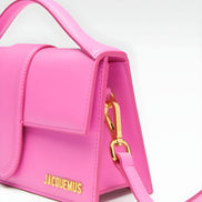 Geantă de mână Jacquemus Le Grand Bambino din piele neon roz