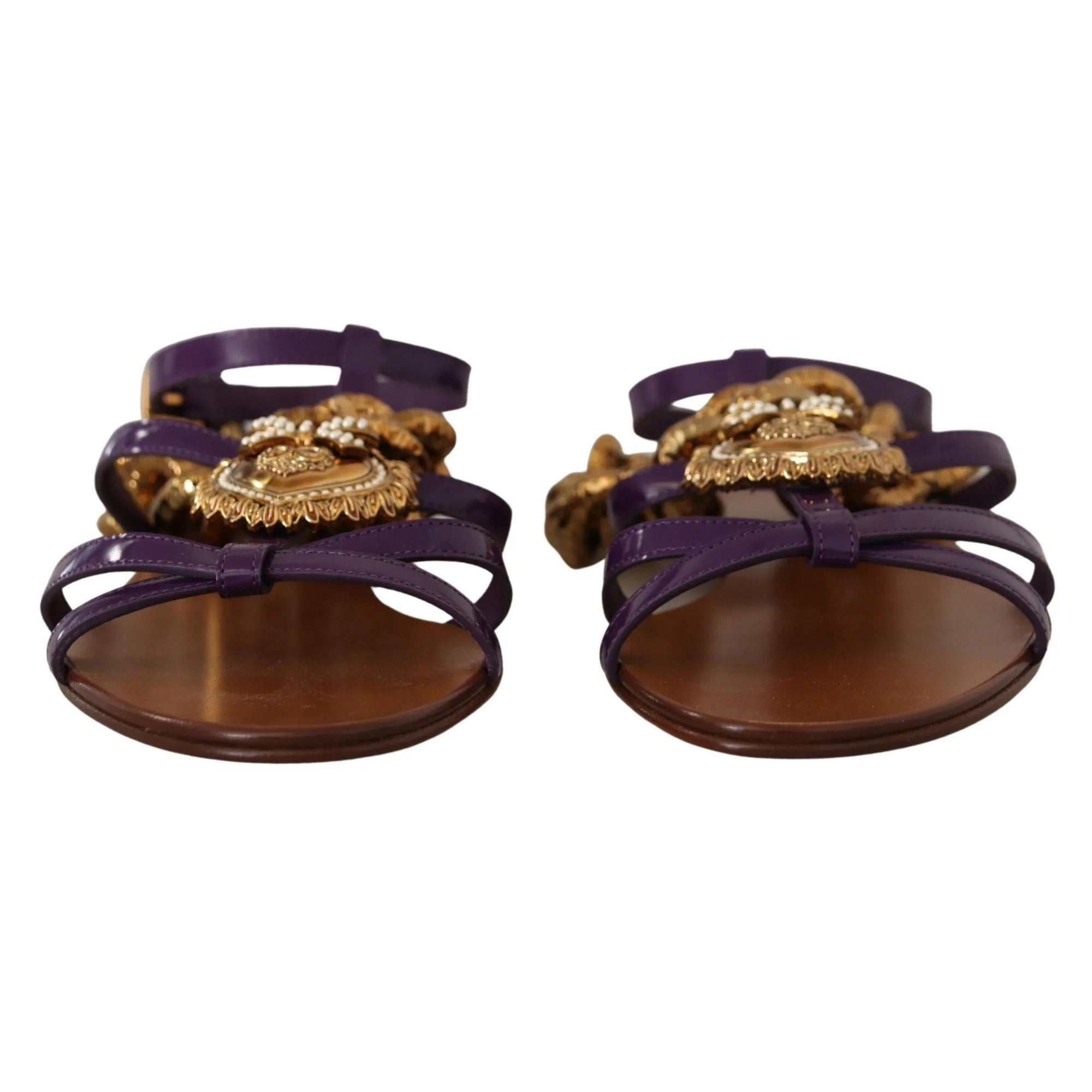 Purple strappy sandals with gold ornate embellishments and brown soles, luxury designer style