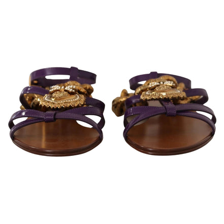 Purple strappy sandals with gold ornate embellishments and brown soles, luxury designer style