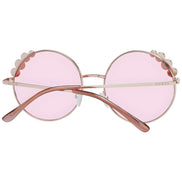 Round pink sunglasses with scalloped metal rims and rose gold frames, viewed from behind.